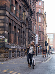 Man walking with electric unicycle in city