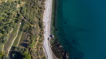 Fantastic landscape taken from the drone at the top of the cliff. Trieste, Italy. Clear sea and blue sky. Rocks and sand. - obrazy, fototapety, plakaty