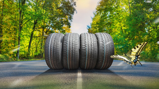 summer tires on the asphalt road in the sun - time for summer tires
