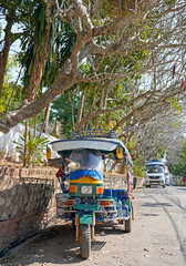 Colorful tuk-tuk in the street in Luang Prabang, Laos 