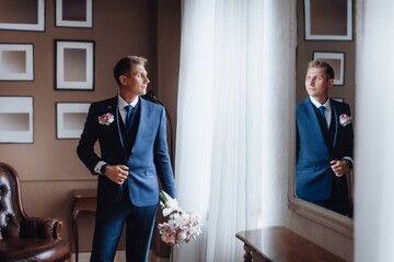 Happy man in a suit on his wedding day. Wedding day concept