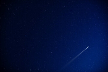 Starry Milky Way skies with comet and meteor shower, falling and shooting stars.
