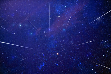 Starry Milky Way skies with comet and meteor shower, falling and shooting stars.