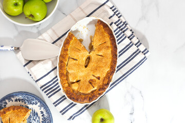 apple pie on white marble table from above