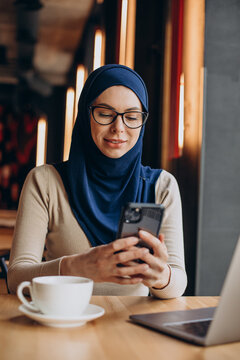 Muslim Business Woman Working On Computer In A Cafe