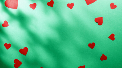 Green background with heart shape for valentines day and copy space