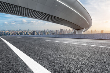 Asphalt road and bridge with city skyline scenery in Shanghai, China.