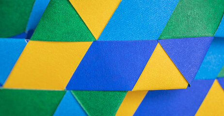 Background abstract geometric design triangle vivid color blue yellow and green weave element wallpaper graphic pattern.Modern fashion style website banner poster,minimal creative desktop backdrop.