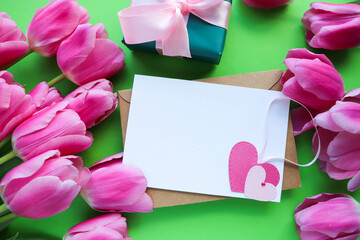 greeting card happy valentine's day. bouquet of tulips and red heart