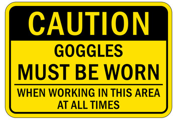 Fototapeta premium Protective equipment sign and labels goggles must be worn when working in this area at all times