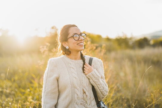 Cheerful woman enjoying time in countryside
