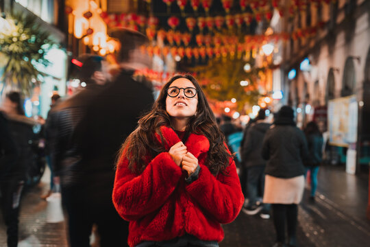 Cheerful woman admiring city street
