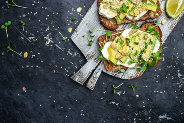 avocado toasts with rye bread, Delicious breakfast or snack, Clean eating, dieting, vegan food concept. top view