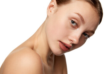 Obraz na płótnie Canvas Half-length portrait of young beautiful girl without makeup on face. Model with bare shoulders. Concept of purity, skin care, beauty, spa, anti-aging procedures
