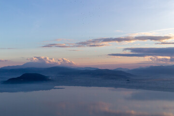 sunset over the mountains and lake