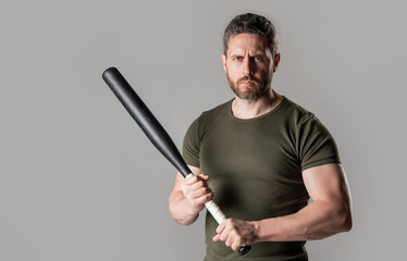 angry man threatening, copy space. angry man express anger with bat isolated on grey