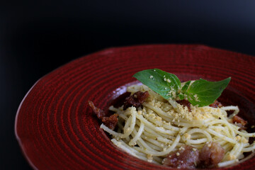 Close up Pesto Spaghetti on Rustic Background