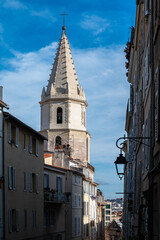 Fototapeta na wymiar Marseille, Provence, France - Narrow alley and roman church tower in old town