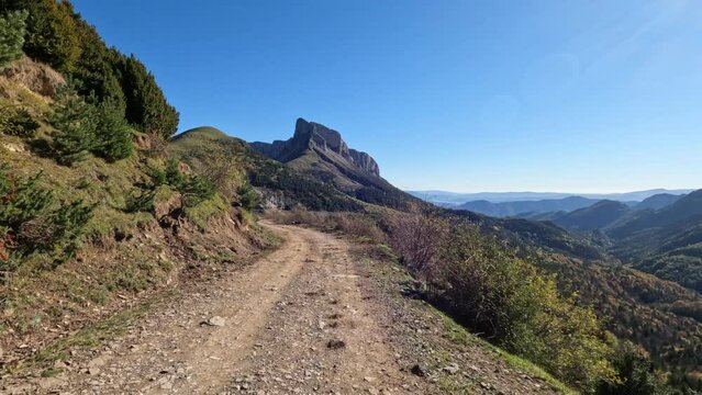 Get off the road recreation dirt road on top of the mountain POV. Nature, landscape and picturesque environment of mountains and forests. Outdoor fun, exploration and entertainment. Viewpoint.