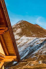 Beautiful alpine summer view with details of a wooden roof at the famous Ahorn summit, Mayrhofen, Zillertal valley, Tyrol, Austria