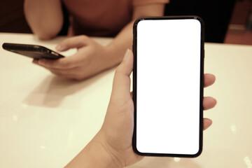 Women's hands holding cell telephone watching social media in a smart phone. social network concept with smart phone