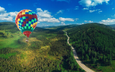 Hot air balloons floating up to the sky . Aerial drone shot