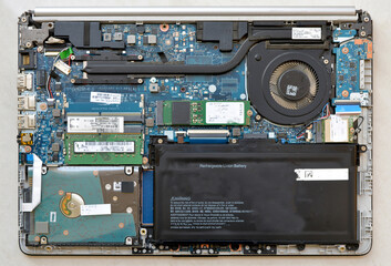 components of a laptop exposed after removing back panel - obrazy, fototapety, plakaty