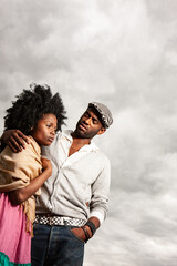 Rural Fashion, Storm Clouds. An uncomfortable and anxious moment between a young couple reflected by the weather. From a series of related images.