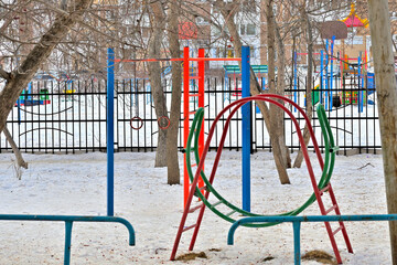 Children's playground on a snowy winter day