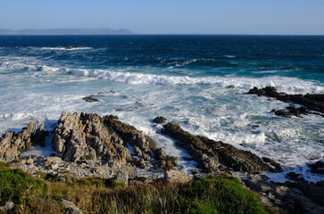 Fototapeta na wymiar Rocks and surf at Hermanus, Western Cape, South Africa