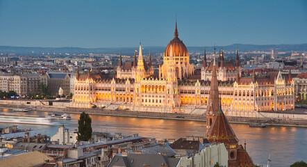 Fototapeta na wymiar Panoramic view of Hungarian Parliament and Danube at twilight in Budapest