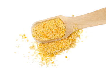 Planed peel orange pile in wooden spoon isolated on white, top view