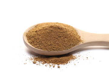 Tikka masala spice powder mix, coriander, cumin, garlic, red pepper chili, mint, black pepper and ginger in wooden spoon isolated on white