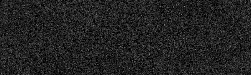 Black rough surface wide texture. Dark fine textured panoramic background