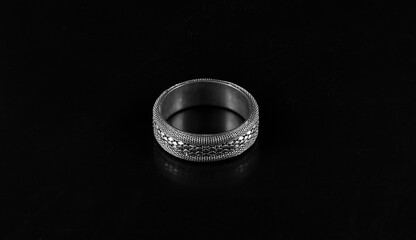 ancient silver ring on a black background