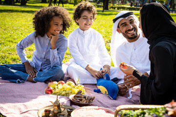 cinematic image of a family from the emirates spending time at the park