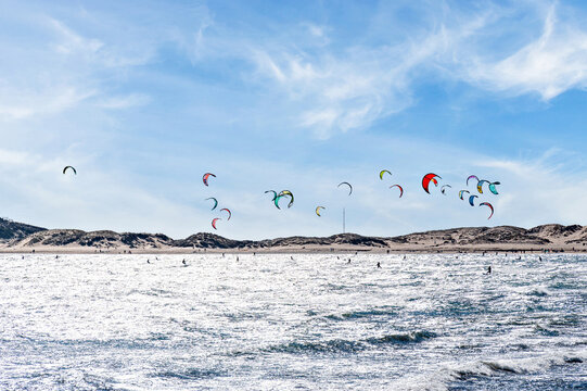 People practicing kitesurfing on the beach of Los Ca&ntilde;os de Meca, next to the Trafalgar Lighthouse, Barbate, C&aacute;diz	