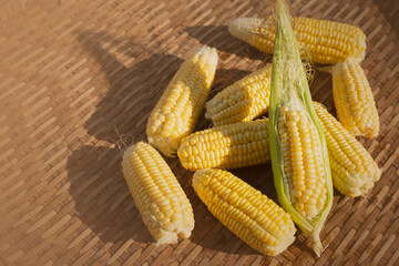 Top view of fresh corn on wooden table. Organic farming, Vegetable healthy.