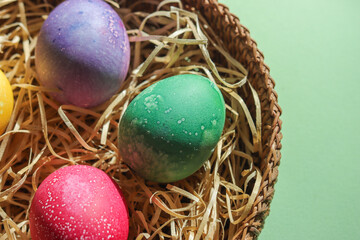 Colorful easter eggs in an easter nest