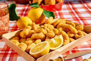 Typical Italian dish mixed deep fried seafood: shrimp, squid, octopus. Unhealthy food, fast food, street food.