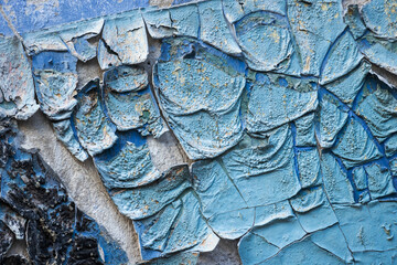 Grungy background, old wall with blue peeling paint