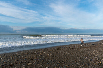 Fototapeta na wymiar person walking on the beach