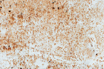 Rusty metal plate with cracks texture on peeling paint, close-up