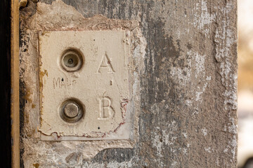 Old Electrical Push Buttons on Wall