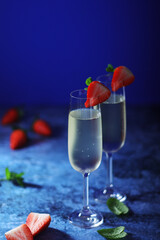 Two glasses of champagne with strawberry	