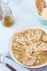 A ceramic bowl with French onion soup