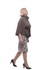 adult woman in a fashionable blouse striding forward .