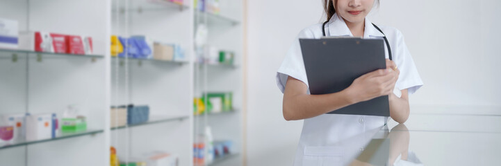 Asian woman pharmacist working at Pharmacy Drugstore . Medical healthcare concept