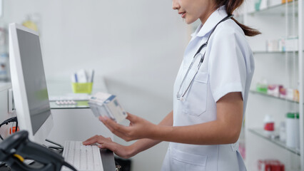 Asian woman pharmacist working at Pharmacy Drugstore . Medical healthcare concept