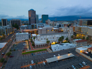 Fototapeta premium St. Augustine Cathedral and Tucson skyscrapers at sunset including One South Church, Bank of America Plaza and Pima County Legal Services Building in downtown Tucson, Arizona AZ, USA. 